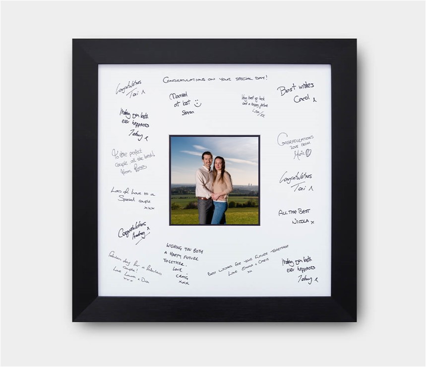 Signing frame with engagement photos