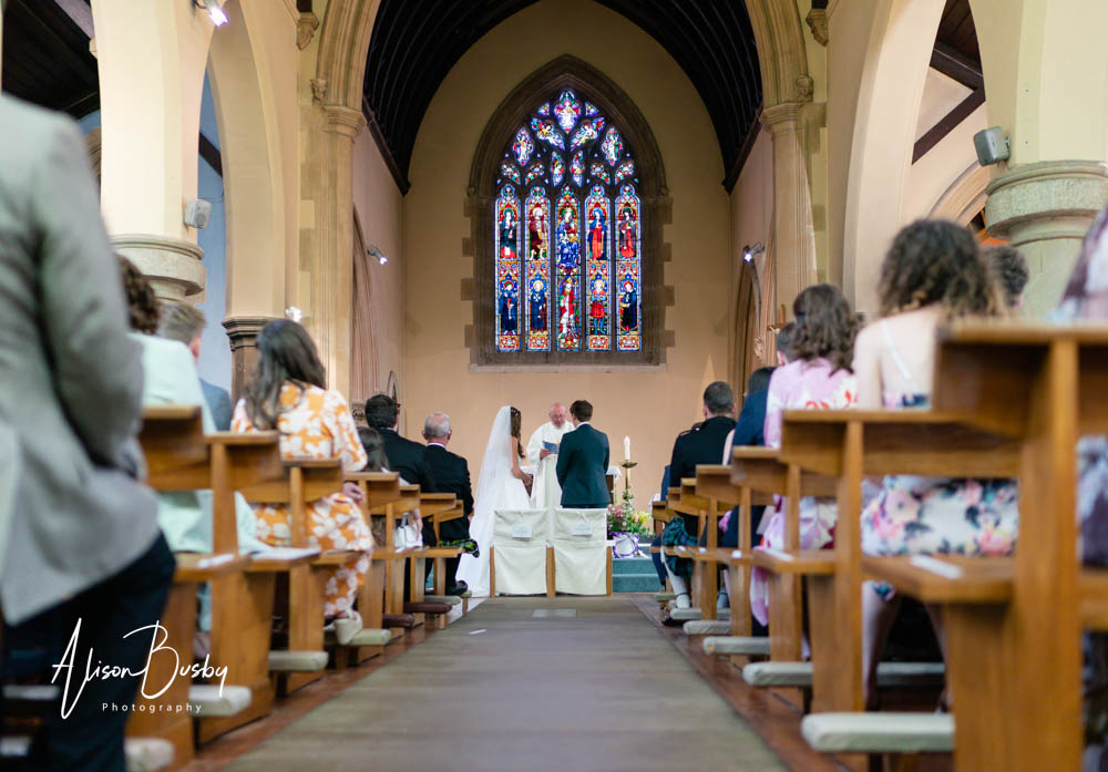 Bride and groom during wedding at our lady and st edmund in abingdon.
