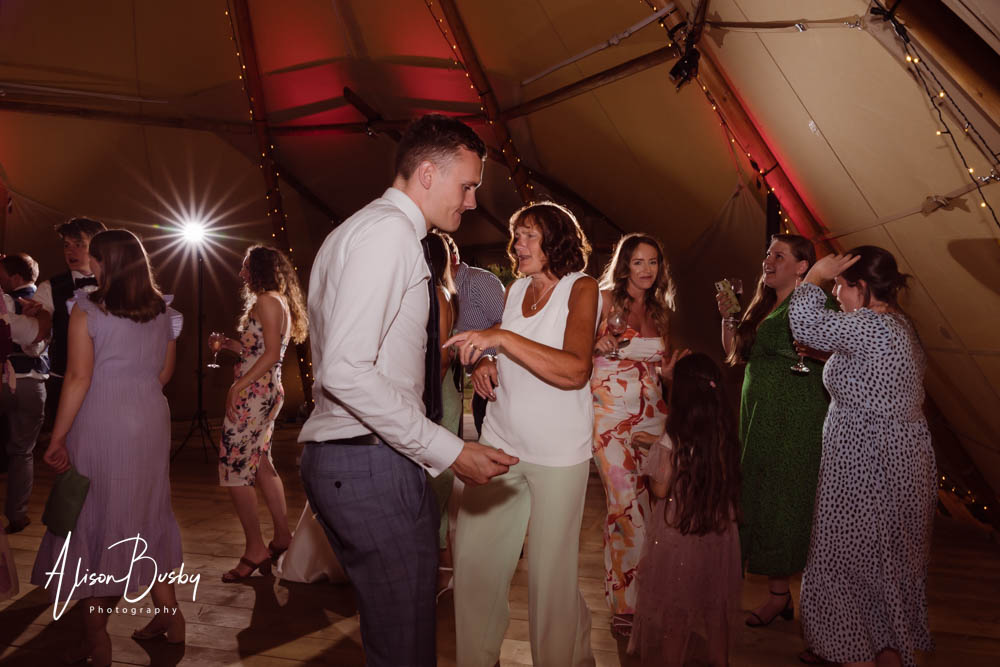Guests dancing at Oxford tipi wedding. Dovecote Events.