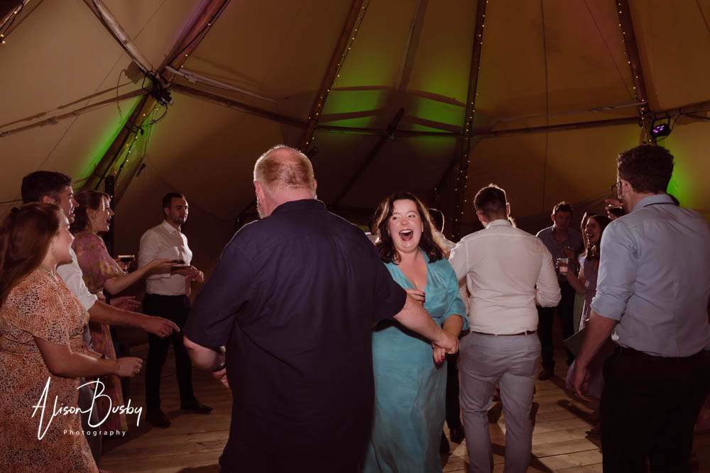 Guests dancing at Oxford tipi wedding. Dovecote Events.