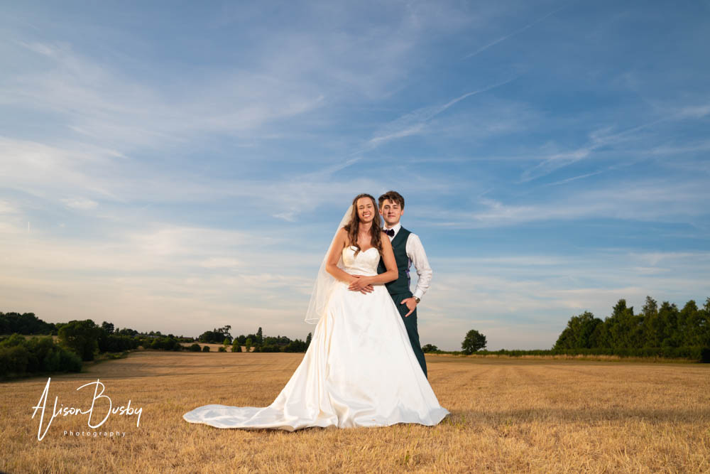 Sunset portrait of bride and groom at Oxfordshire tipi wedding. Dovecote Events.