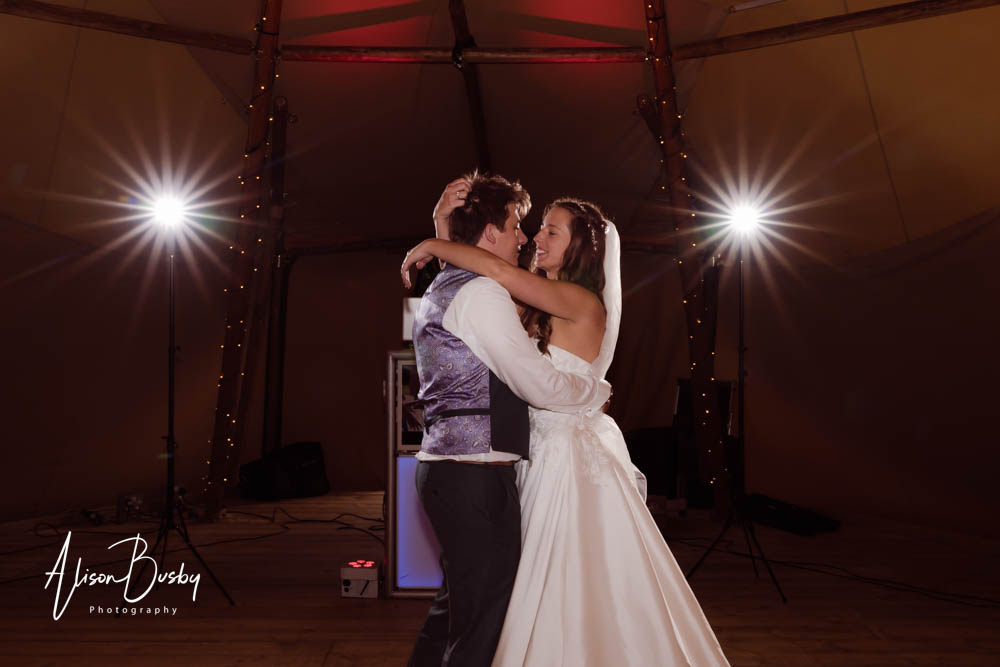Bride and groom first dance in tipi wedding Oxfordshire.