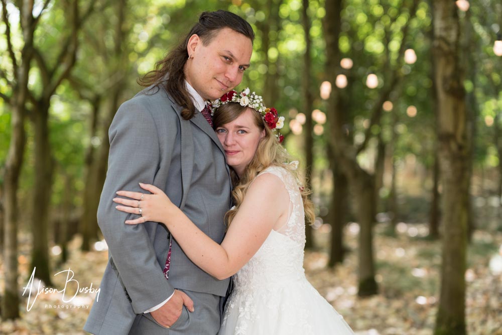 Buckinghamshire woodland wedding. Bride and groom under the tree canopy at Endeavour Woodland Weddings.