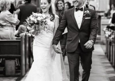 Bride and groom leaving ceremony at All Saints Church Marlow