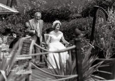 Bride and guest laughing at Kings Chapel wedding in Amersham