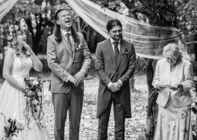 Wedding party laughing at Buckinghamshire woodland wedding