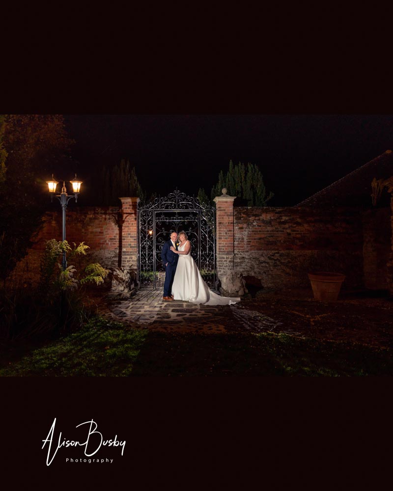Night photo of bride and groom at the Cosener's House in Abingdon Oxfordshire.