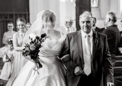 Bride walking up the aisle at Bedford wedding