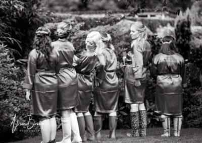 Bridesmaids comparing bottom sizes at Buckinghamshire wedding
