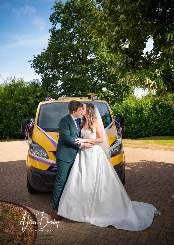 Bride and groom in grounds by Dovecote Events Wedding Photographer