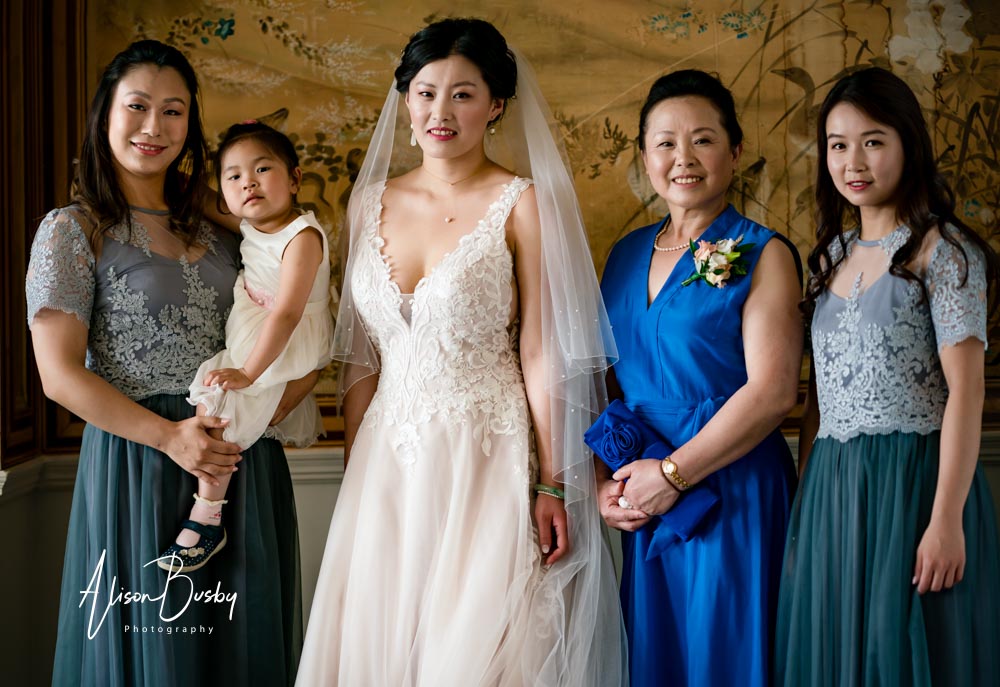 Bride and bridesmaids by Eynsham Hall wedding photographer