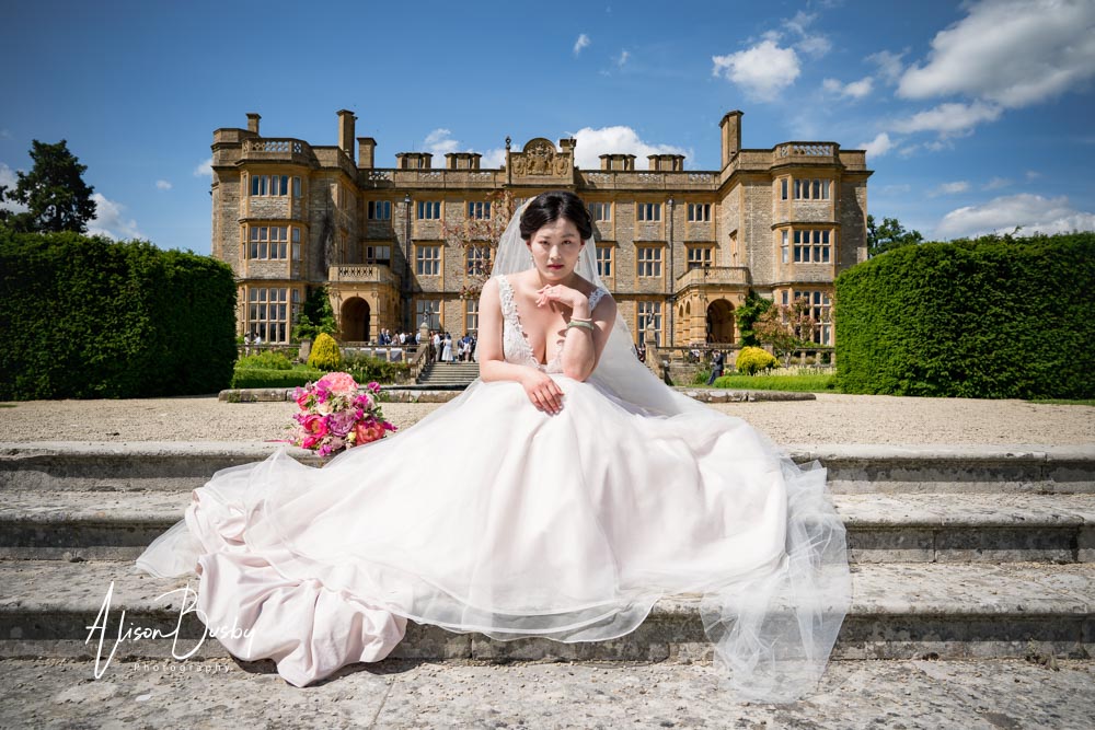 Eynsham Hall wedding photographer. Bride at Eynsham Hall in Oxfordshire. Award winning photo