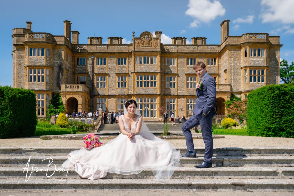 Bride and groom in garden at Eynsham Hall wedding