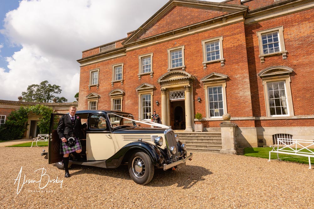 Kelmarsh Hall wedding photographer. Groom arrives