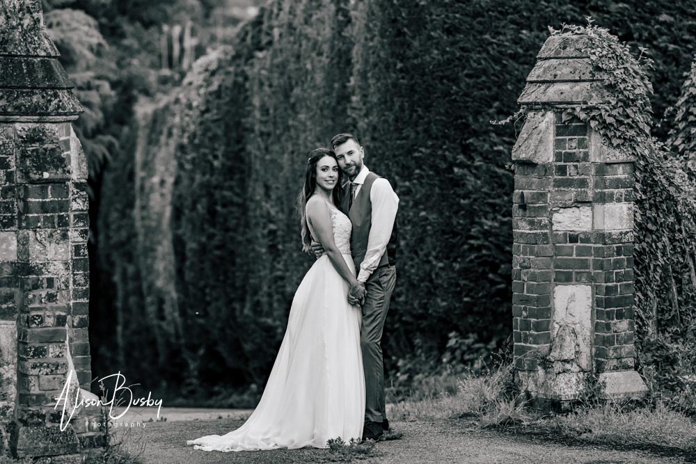Sunset portrait of bride and groom at Kings Chapel Amersham in black and white