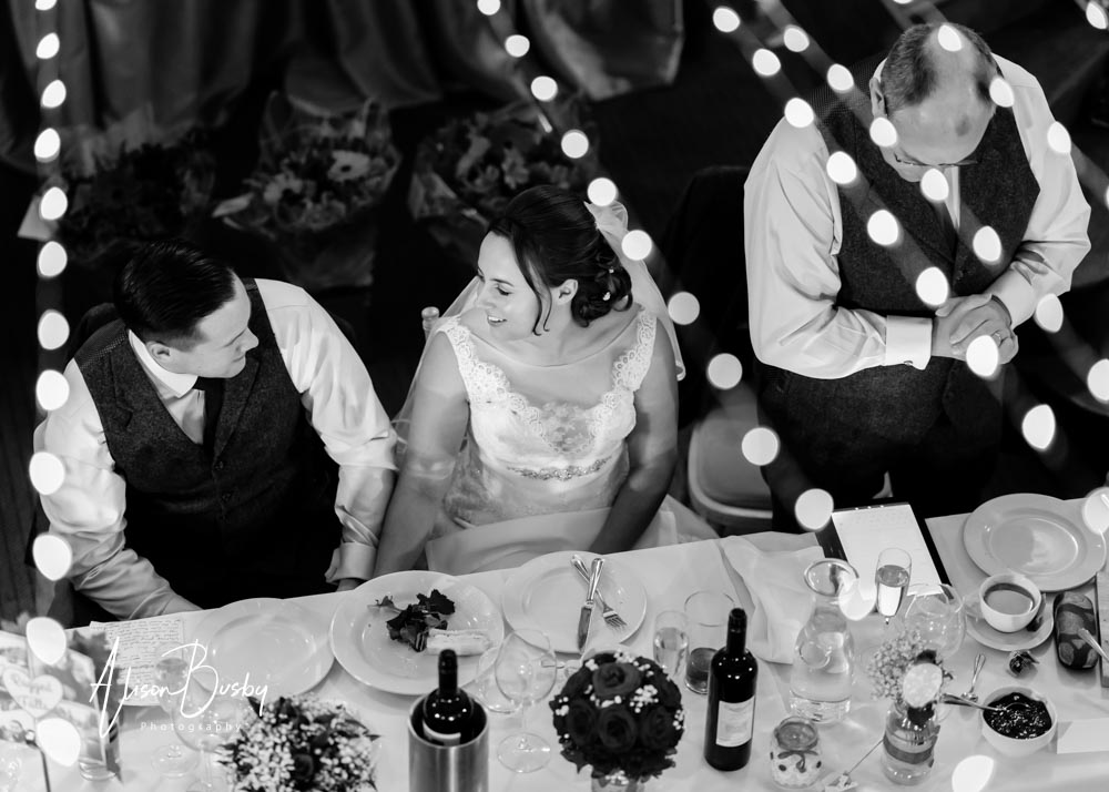 Kings Chapel Wedding. Bride and groom inside chapel at night in black and white