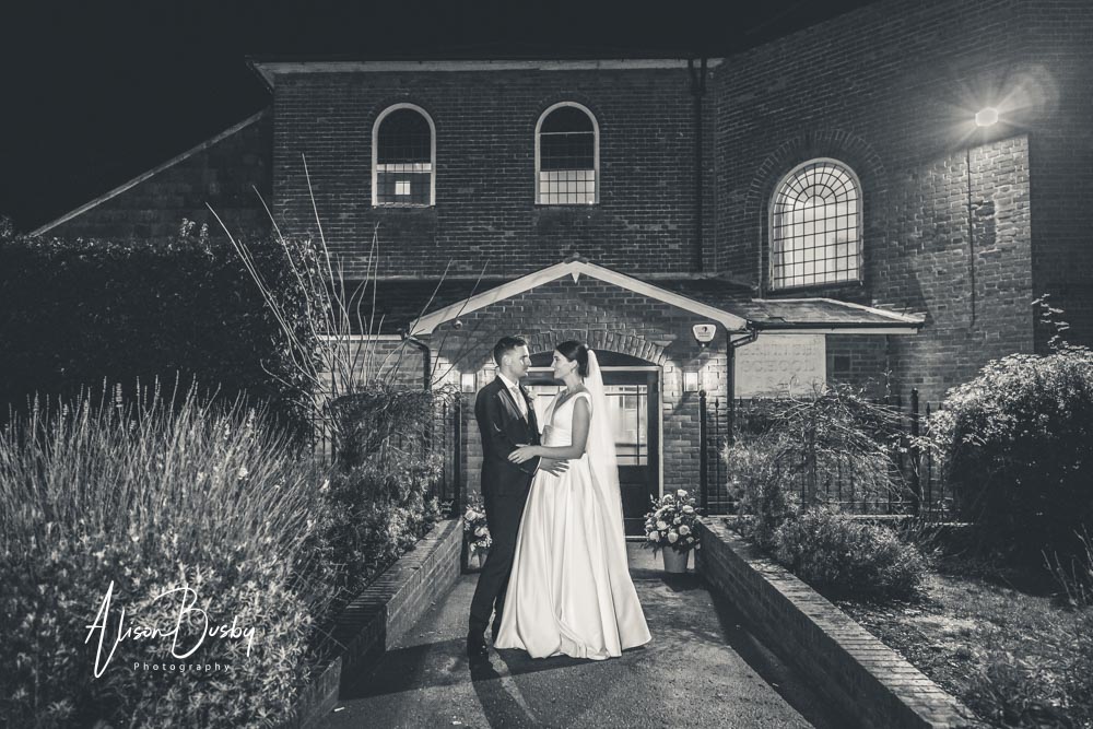 Bride and groom at Kings Chapel wedding at night.