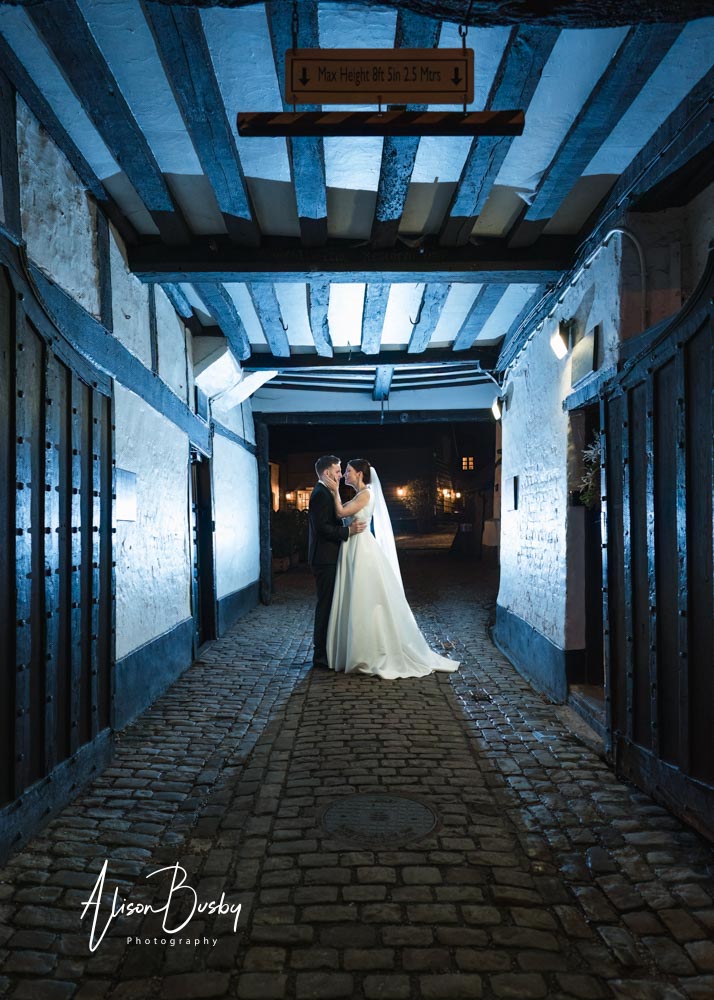 Bride and groom at Kings Chapel wedding at night.