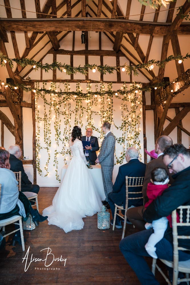 Wedding ceremony at Old Luxters Barn in Oxfordshire