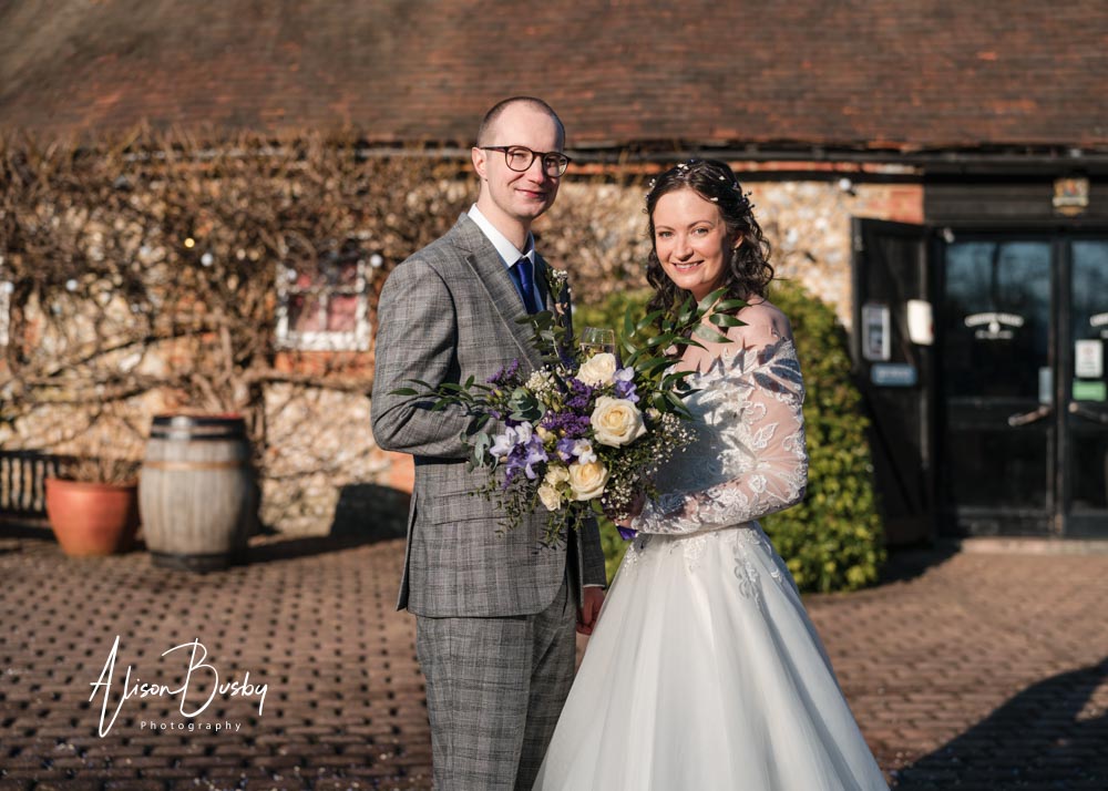 Bride and groom portrait by Luxters Barn wedding photographer