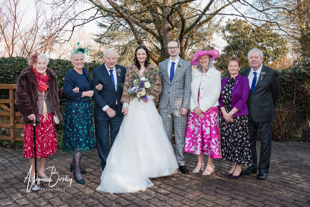 Group photo at luxters barn wedding in oxfordshire