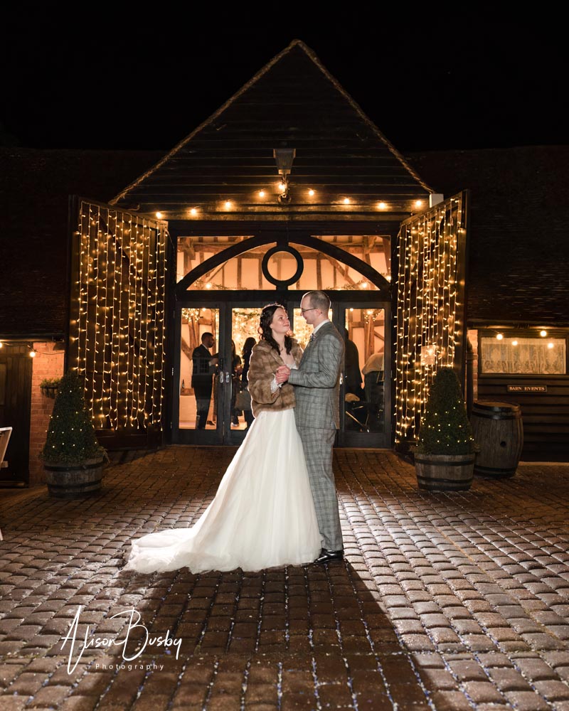 Night portraits of bride and groom by Luxters barn wedding photo