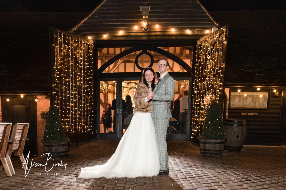 Night portraits of bride and groom by Luxters barn wedding photo