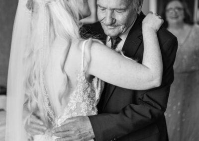 Father of the bride embracing his daughter at Shendish Manor wedding