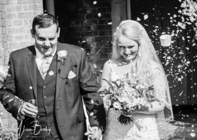 Bride and groom confetti tunnel at Shendish Manor