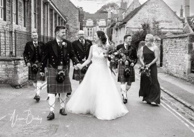 Wedding party walking at Burford wedding