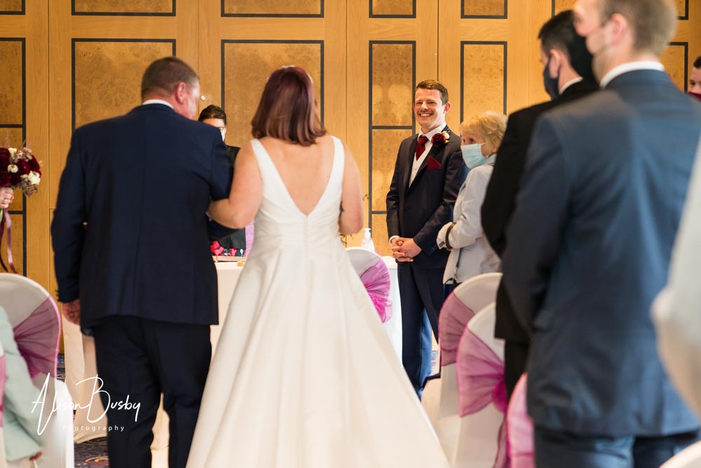 The Oxfordshire wedding photographer. Bride arrives with father