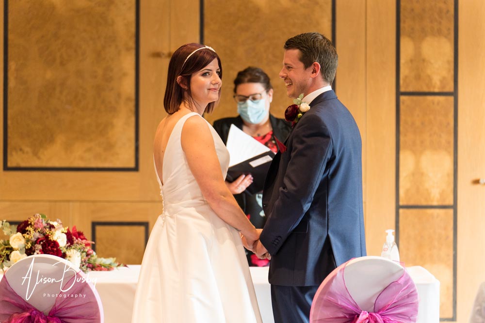 The Oxfordshire wedding photographer. Bride and groom exchange vows