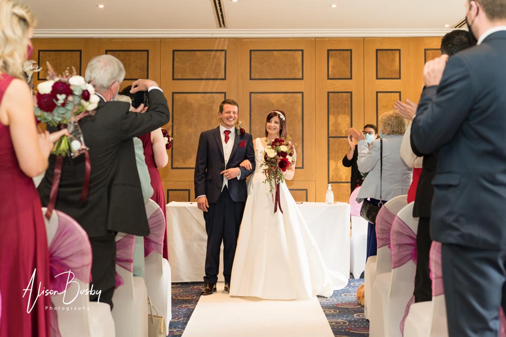 The Oxfordshire wedding photographer. Bride and groom greet guests