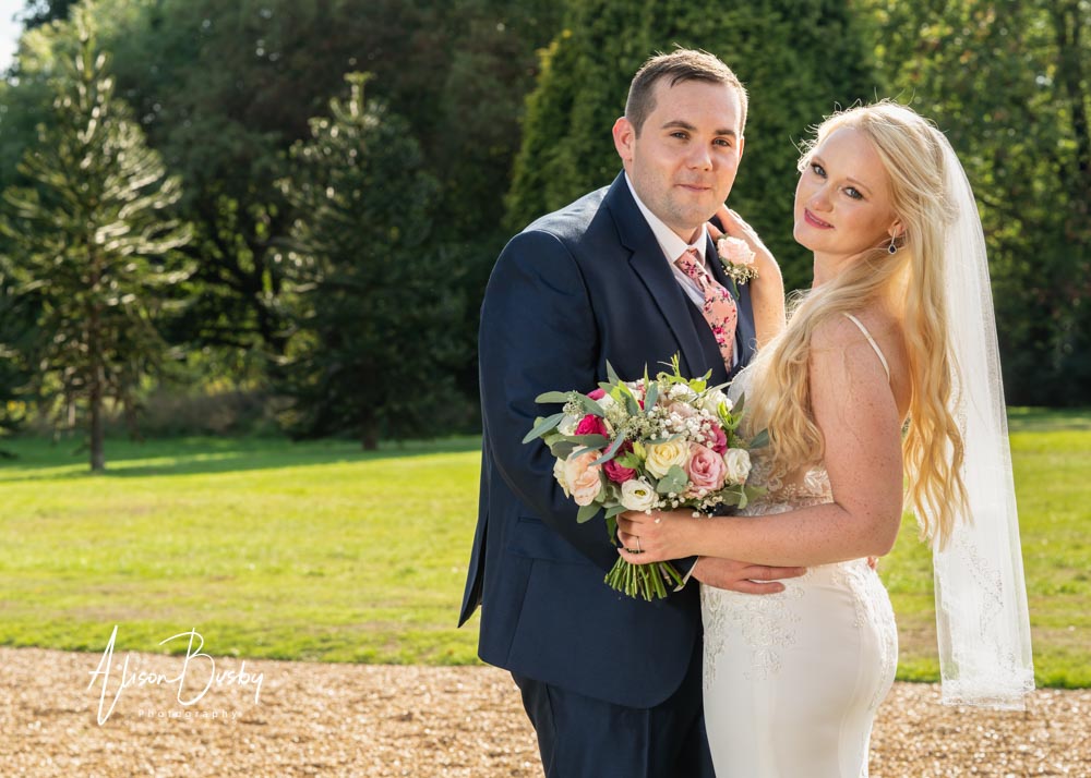 Bride and groom in gardens of Shendish Manor by Alison Busby Photography