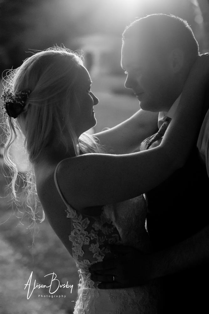 Sunset shot of bride and groom. Black and white by Alison Busby Photography