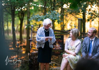 Buckinghamshire woodland wedding. guests around fire pit at Endeavour woodland weddings.