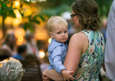 Buckinghamshire woodland wedding. guests around fire pit at Endeavour woodland weddings.