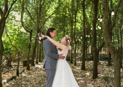 Buckinghamshire woodland weddings. Bride and groom under tree canopy at Endeavour woodland weddings.