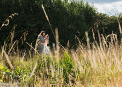 Buckinghamshire woodland weddings. Bride and groom next to lake at Endeavour woodland weddings.