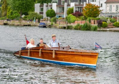 Compleat Angler wedding photographer. Bride and groom arriving by motor launch