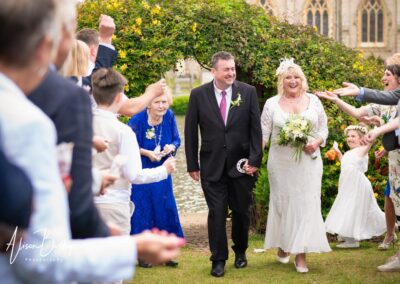 Compleat Angler wedding photographer. Bride and groom under confetti tunnel