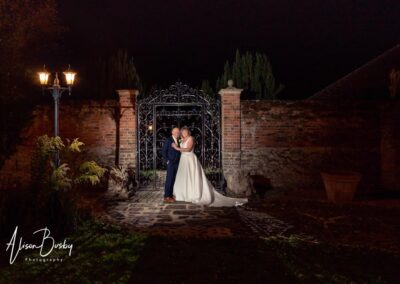 Cosener's House wedding photographer. Bride and groom in gardens of Coseners House at night.