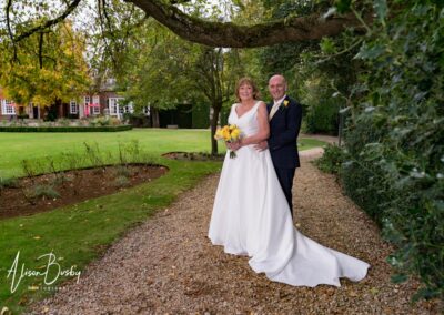 Cosener's House wedding photographer. Bride and groom in garden