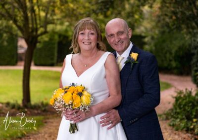 Cosener's House wedding photographer. Bride and groom in garden