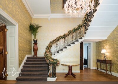 Hedsor House wedding photographer. staircase decorations at Christmas.