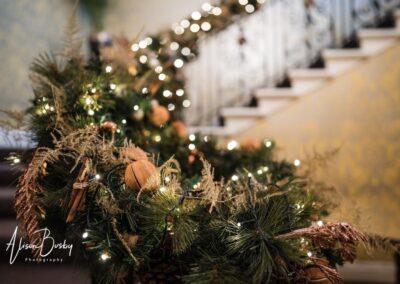 Hedsor House wedding photographer. staircase decorations at Christmas.