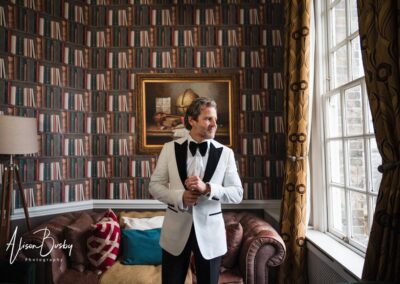 Hedsor House wedding photographer. Groom in the Dustin suite.