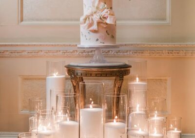 Hedsor House wedding photographer. wedding cake and candles