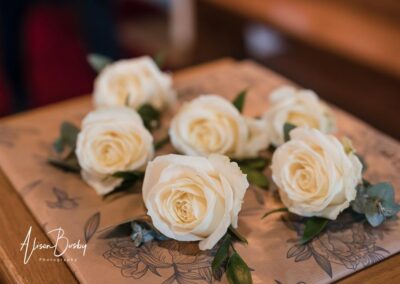 Kings Chapel Old Amersham. Winter wedding. White rose buttonholes.