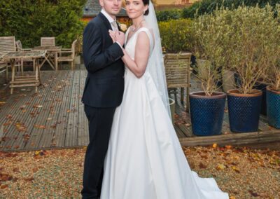 Kings Chapel Old Amersham. Winter wedding. Bride and groom in gardens of kings chapel with view of hills